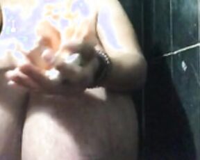 janet soaping udders in shower