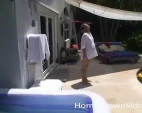 Pregnant woman plays with her girlfriend outside